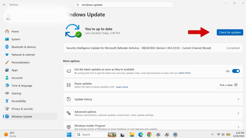 Windows 11 Windows Update settings screen with a red arrow pointing to the Check for updates button to fix missing Bluetooth.