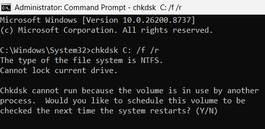 Windows Administrator Command Prompt showing a prompt to schedule a CHKDSK scan on the next system restart because the C drive is currently in use.