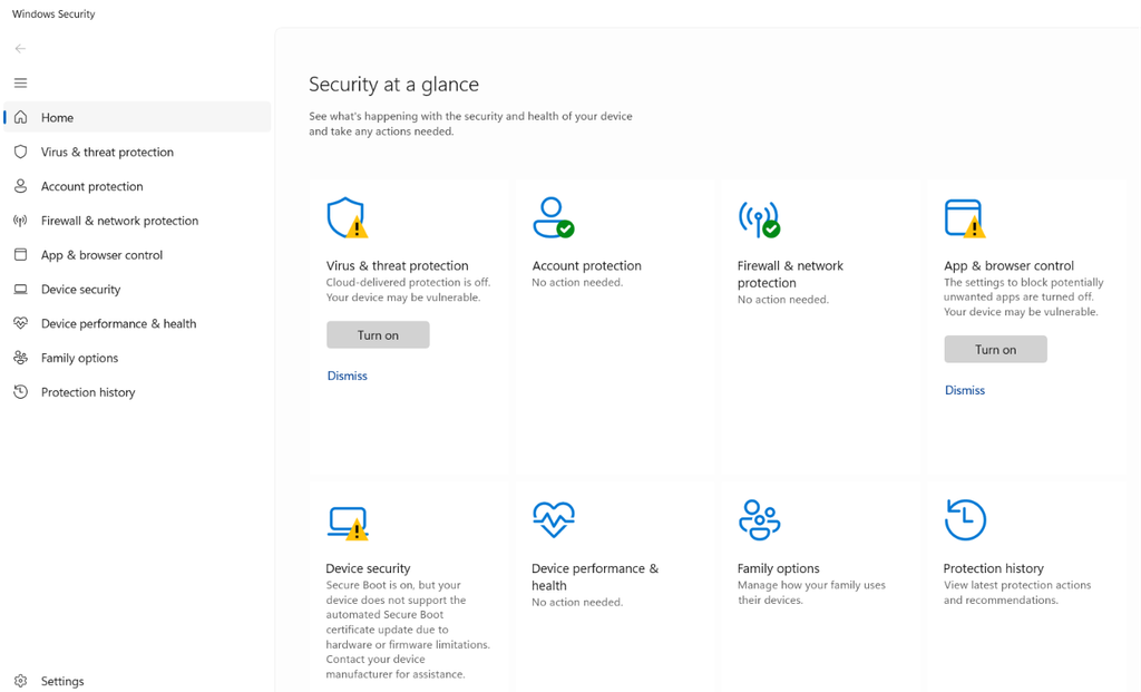  Screenshot of the Windows Security dashboard showing the Security at a glance home page with yellow warning icons on Virus and threat protection, App and browser control, and Device security.